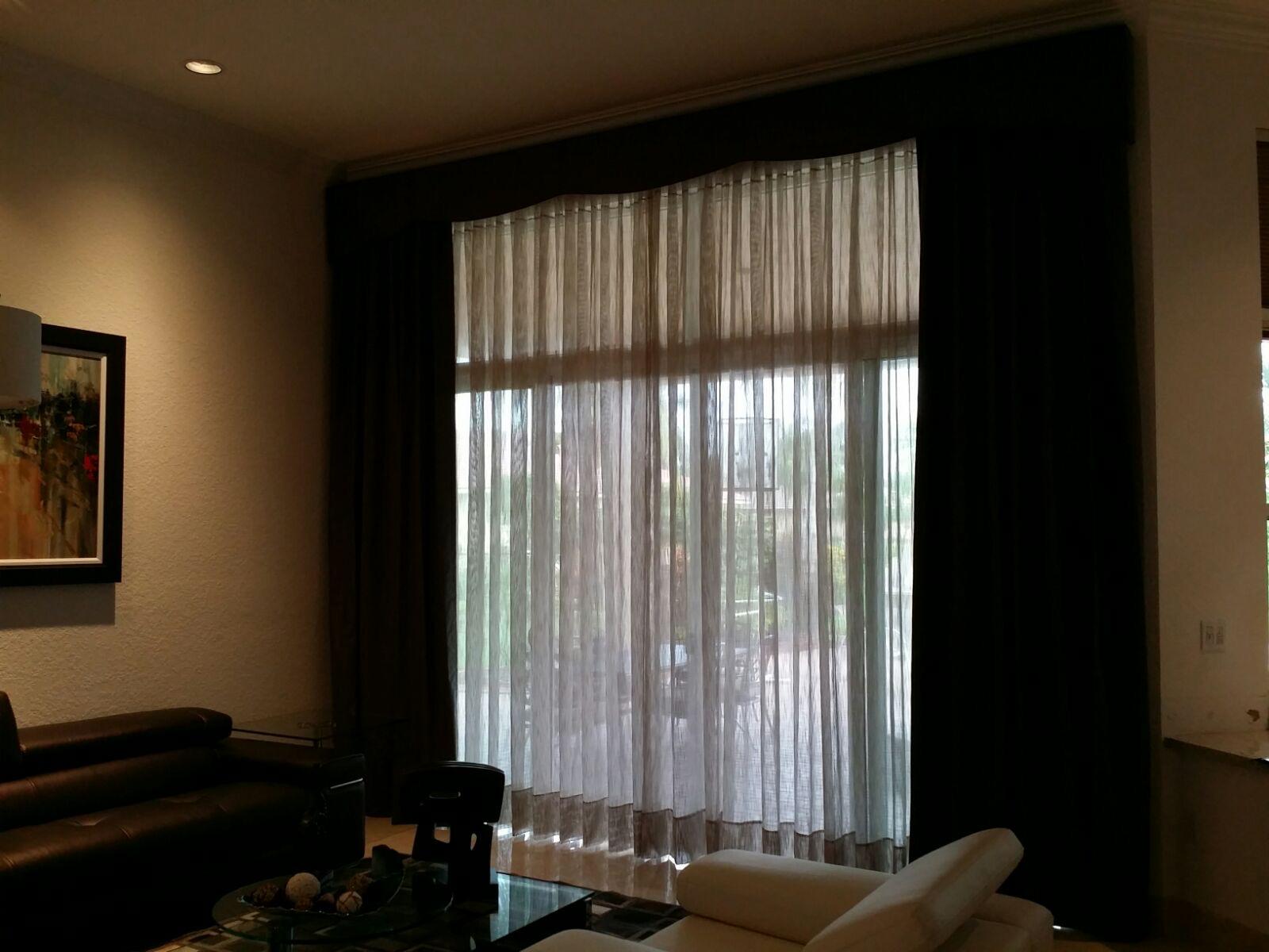 Living room drapery with sheer panels and a decorative valance